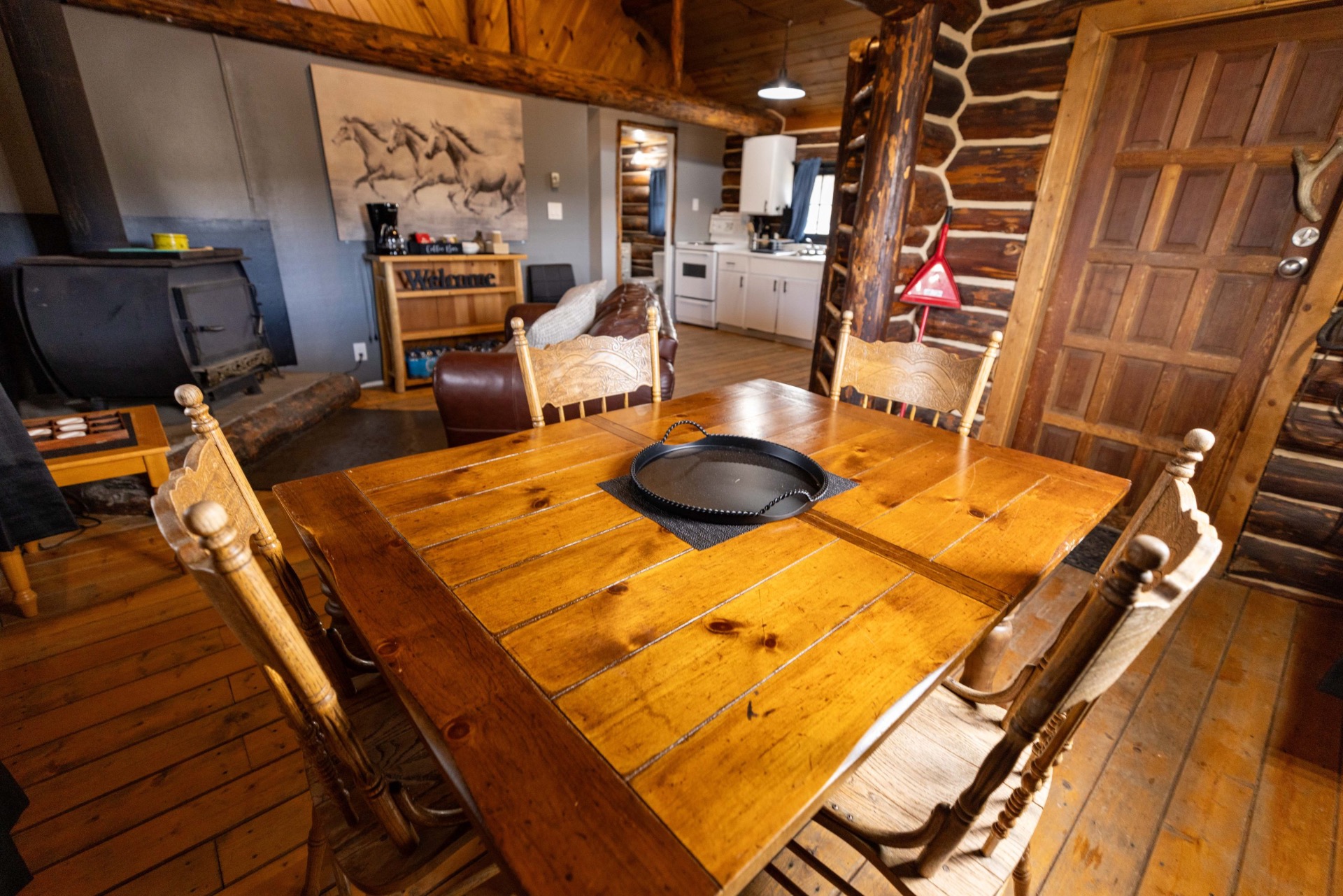 Dining table and open kitchen inside Cabin 3