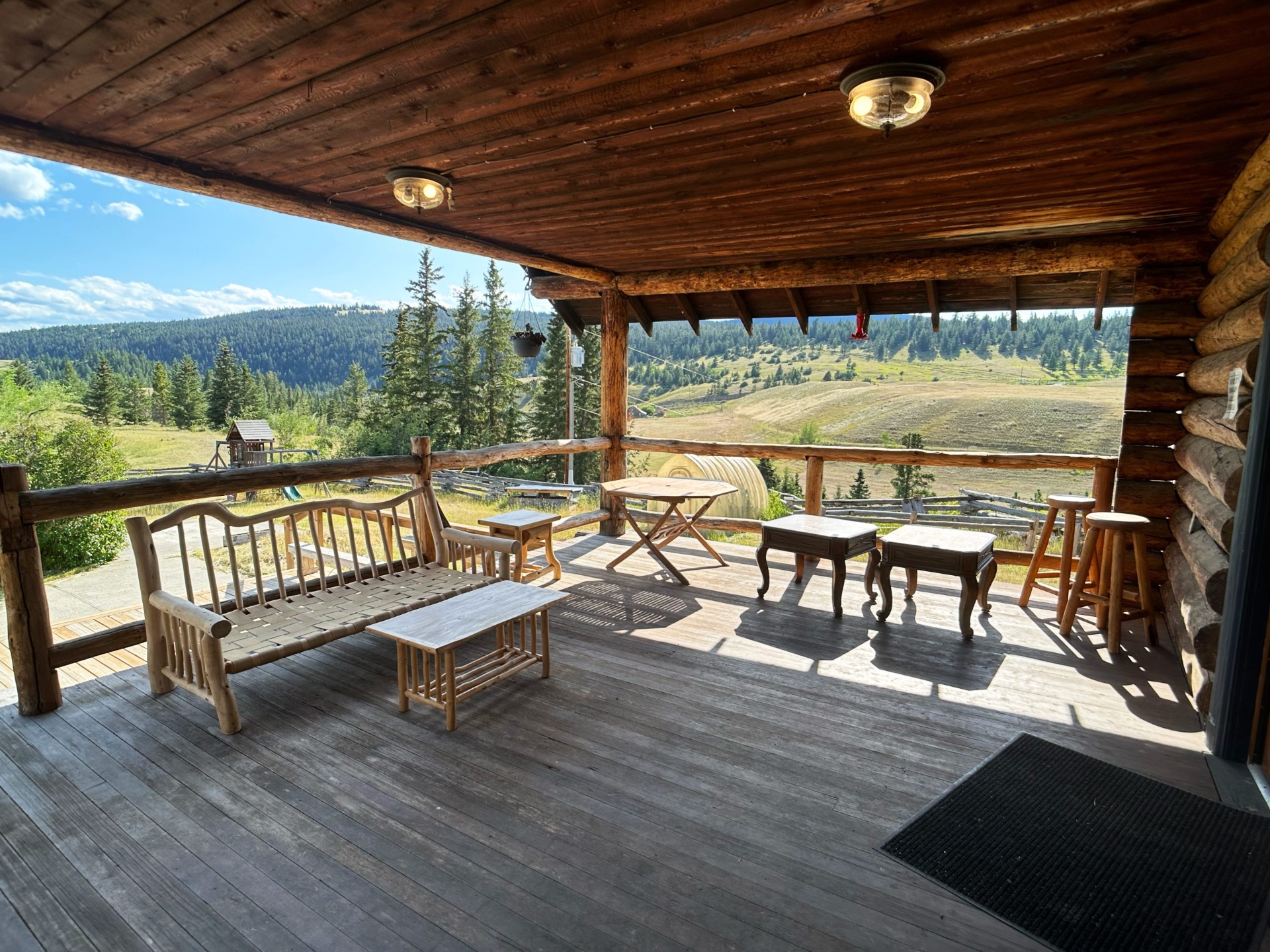 Harrison House covered deck with valley and hill views